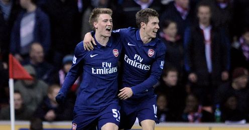 Happier times: Ramsey (right) helps Nicklas Bendtner celebrate his equaliser against Stoke