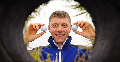Jamie poses with the two balls he holed in one.