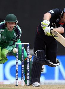 Rain sends England through