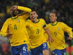 Juan celebrates with Lucio and Luis Fabiano.