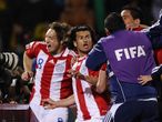 Paraguay celebrate beating Japan on penalties and making the World Cup quarter-finals for the first time in their history.