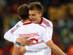 Denmark scorers Rommedahl and Bendtner celebrate.