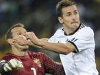 Miroslav Klose heads in Germany's second...