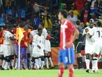 Ghana celebrate with goalscorer Asamoah Gyan.