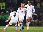 Diego Forlan celebrates his opener with Jorge Fucile and Alvaro Pereira