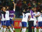 The final whistle goes and South Korea celebrate reaching the knockout stages.