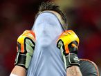 Upset: Diego Benaglio of Switzerland covers his face in dejection.