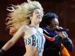 Shakira in full swing: The Colombian pop singer let her hair out - and she was dressed in a rather skimpy outfit too...