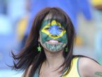 Colours of Brazil: A Brazil fan shows her allegiance prior to the game.