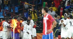 Ghana celebrate with goalscorer Asamoah Gyan.