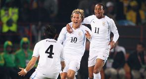 Diego Forlan celebrates his opener with Jorge Fucile and Alvaro Pereira