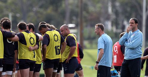 Thirsty work: Johnson (right) makes sure his squad has drinks to hand