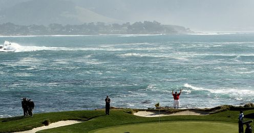 The world famous 17th green at Pebble Beach with Monterey Bay in the background