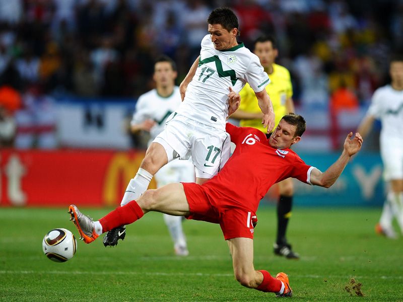James Milner slides in to tackle Andraz Kirm; foto skysports.com