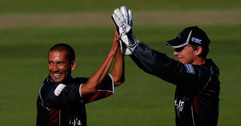 Plan comes together: Thomas (left) celebrates another well-executed wicket for Somerset
