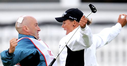 Katherine Hull celebrates her eagle on the last with her caddyy