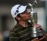 Open champion Louis Oosthuizen kisses the Auld Claret Jug.