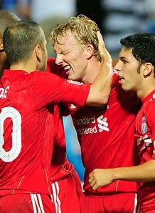 Reds roar back to go through