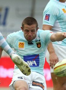 Perpignan s scrum half David Mele kicks Perpignan s scrum half David Mele kicks