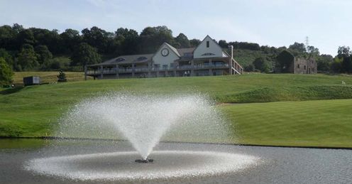 A view across the lake at 18 to the clubhouse at Celtic Manor