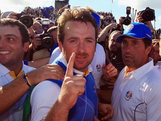 Graeme McDowell celebrates as his victory over Hunter Mahan wins the Ryder Cup for Europe.