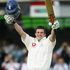 The left-hander celebrates reaching a hundred on his Test debut.