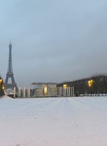 Two people jogging by Eiffel Tower Two people jogging by Eiffel Tower