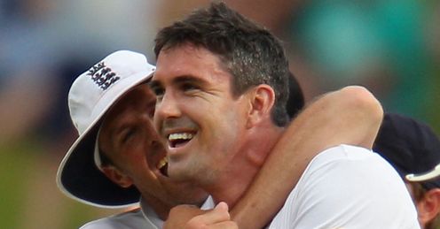Golden arm: Swann embraces Pietersen after Clarke's downfall late on day four in Adelaide