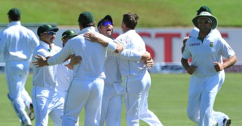 Bond of brothers: South Africa celebrate the fall of Virender Sehwag's wicket in the first Test