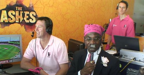 Tickled pink: Glenn and a marvellously-attired Mikey share a joke in the 