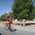 The locals have really taken this race to their hearts and this rider is now a cult figure, showing up every day flying his flag