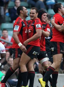 Crusaders celebrate score against Sharks