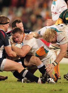 Coenie Oosthuizen of Cheetahs is tagged by Greg Somerville Coenie Oosthuizen of Cheetahs is tagged by Greg Somerville