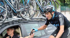 Michael Barry gets supplies from Sean Yates during the stage