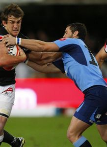 Keegan Daniel fending off Francois Brummer Keegan Daniel fending off Francois Brummer