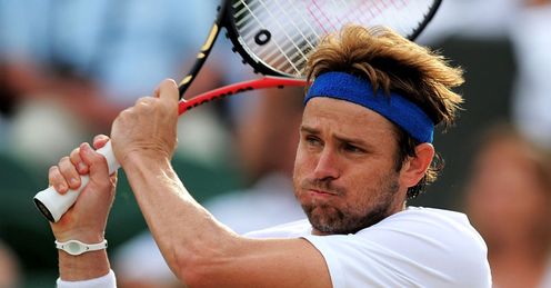 Power game: Fish en route to victory over Tomas Berdych at Wimbledon, before losing to Nadal
