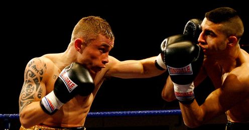 First to the punch: Frampton (left) during a victory over Yohan Boyeaux in 2010