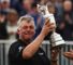 Darren Clarke lifts the precious Claret Jug.