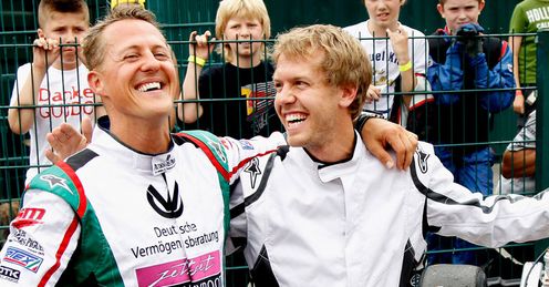 Bright outlook: Vettel enjoys a lighter moment with Michael Schmacher at a go-karting event