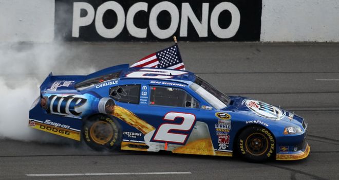 Brad Keselowski fought through the pain of a broken ankle to take victory in