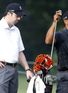 Comeback: Tiger Woods and caddie Bryon Bell prepare for Bridgestone 