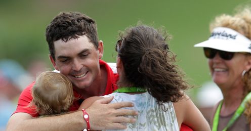 Bradley celebrating with his family after his victory