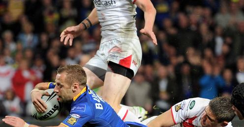 Opening salvo: Rob Burrow stretches for the line to register the first try of the final