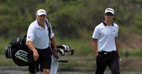 Scott (R) and his caddie in Sydney on Wednesday.