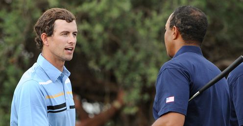 Adam Scott shakes hands with Tiger Woods after their match
