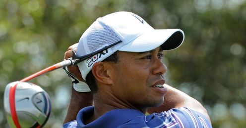 Peace-maker: Woods warms up for the Australian Open, in Sydney