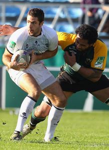 Remi Tales taking on Samu Manoa in Castres v Northampton Remi Tales taking on Samu Manoa in Castres v Northampton