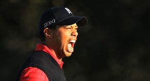 Tiger Woods roars after sinking a critical 15-footer at the 17th that was to lead to his first victory in two years.