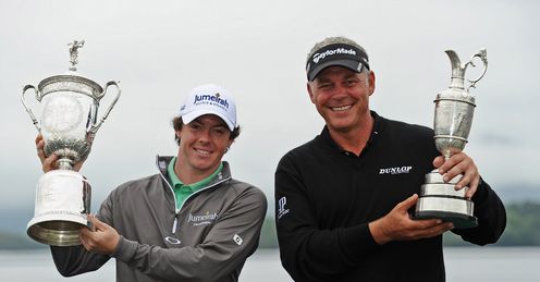 Clarke and McIlroy hold their major trophies aloft