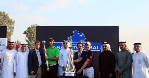 Big winners Alvaro Quiros and Luke Donald pose with officials and sponsors in Dubai.
